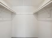 Thumbnail 9 of 20 - A white room with a grey floor and white walls.