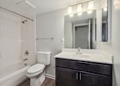 Thumbnail 6 of 30 - the preserve at ballantyne commons apartment bathroom with sink toilet and shower