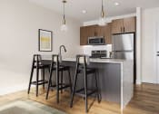 Thumbnail 17 of 44 - a kitchen with a large island with three bar stools at Boardwalk at Research Park in Alabama 35811
