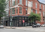 Thumbnail 46 of 46 - an old brick building on the corner of a city street