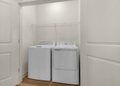 Thumbnail 10 of 35 - two washers and dryers in a laundry room with white walls at The Enclave at Deer Moss Creek, Niceville, FL