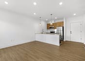 Thumbnail 11 of 44 - A kitchen with white cabinets and a wooden countertop.
