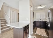 Thumbnail 7 of 33 - a kitchen with a sink and a counter top in a new home