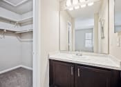 Thumbnail 14 of 33 - a bathroom with a sink and a mirror