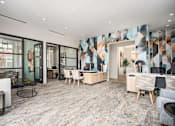 Thumbnail 24 of 31 - A modern living room with a grey carpet and wooden furniture.