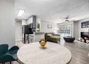 Thumbnail 3 of 50 - A modern kitchen with a dining table and chairs.