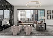 Thumbnail 14 of 52 - A modern living room with a view of the city.