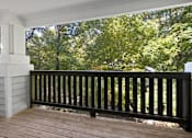 Thumbnail 29 of 67 - A balcony with a black railing and a white column.