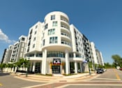 Thumbnail 1 of 40 - a large white building on the corner of a city street