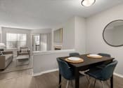 Thumbnail 14 of 67 - A dining room with a table set for two.