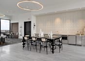 Thumbnail 21 of 52 - A modern dining room with a large table and chairs.