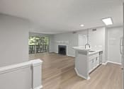 Thumbnail 33 of 67 - A kitchen with white cabinets and a wooden floor.