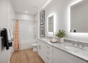 Thumbnail 7 of 29 - a bathroom with two sinks and a shower and a toilet