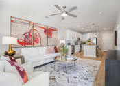 Thumbnail 2 of 29 - a living room with couches and a table