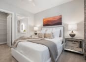 Thumbnail 5 of 29 - a bedroom with a bed and a closet