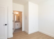Thumbnail 30 of 81 - a bedroom with white walls and hardwood floors at Ainsworth, Richmond, Virginia