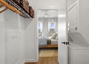 Thumbnail 21 of 51 - A white bedroom with a bed and a window with curtains.