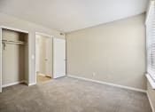 Thumbnail 19 of 33 - an empty living room with a door to a closet