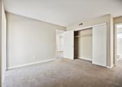 Thumbnail 17 of 33 - an empty living room with an open door to a closet