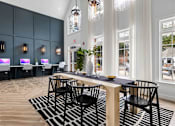 Thumbnail 20 of 45 - A modern dining area with a long table and chairs.
