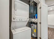 Thumbnail 46 of 64 - A white oven and stove top are in a kitchen.