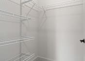 Thumbnail 31 of 52 - Empty white shelves in a room.