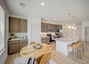 Thumbnail 28 of 50 - Kitchen and dining area at The Enclave at Deer Moss Creek, Niceville, Florida