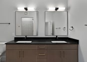 Thumbnail 32 of 52 - A bathroom with two sinks and a toilet.