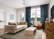 Thumbnail 19 of 44 - a living room with a couch and a coffee table at Boardwalk at Research Park in Huntsville, AL 35811