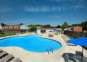 Thumbnail 4 of 12 - Affordable Woodbriar Apartments features a community pool
