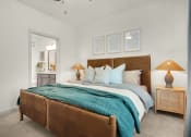 Thumbnail 4 of 35 - a bedroom with a large bed and a closet at The Enclave at Deer Moss Creek, Niceville, 32578
