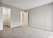 Thumbnail 43 of 44 - an empty bedroom with an open door to a closet at Wendover River Oaks, Greensboro, North Carolina