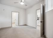 Thumbnail 11 of 31 - an empty bedroom with a closet and a door to a bathroom at The Falstaff, North Carolina