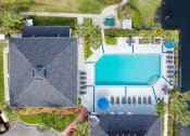 Thumbnail 21 of 40 - Aerial of pool at Cypress Run Apartments in Orlando FL