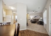 Thumbnail 9 of 46 - a view of a living room and dining room from a dining room table