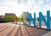 Thumbnail 21 of 22 - A large outdoor sign with the word LOVE in yellow and N in blue.