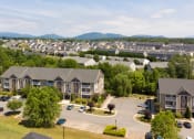 Thumbnail 19 of 21 - an aerial view of a neighborhood with houses and trees