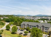 Thumbnail 18 of 21 - an aerial view of a neighborhood with houses and trees