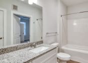 Thumbnail 18 of 42 - a bathroom with a sink and a shower and a toilet at The Bella at Westchester, Midlothian