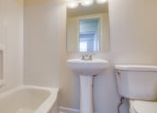 Thumbnail 24 of 24 - a white bathroom with a sink toilet and a tub at Gates of West Bay in Norfolk, VA 