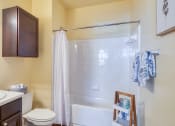 Thumbnail 39 of 60 - a bathroom with a shower and a sink and a toilet at Proximity at ODU, Norfolk, VA, 23508