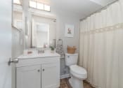 Thumbnail 15 of 43 - a bathroom with a sink toilet and a shower at Village 1373, Greensboro North Carolina