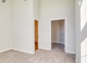 Thumbnail 15 of 42 - an empty bedroom with a door to a bathroom and a closet at The Bella at Westchester, Midlothian, 23113