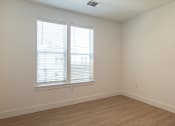 Thumbnail 25 of 81 - a bedroom with two windows and a wooden floor at Ainsworth, Virginia