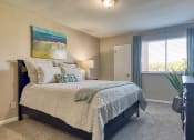 Thumbnail 9 of 15 - a bedroom with a large bed and a window