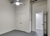 Thumbnail 12 of 46 - an empty room with white walls and a ceiling fan at The Hudson, Virginia, 23224