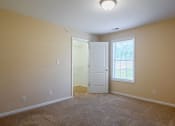Thumbnail 5 of 21 - a room with carpet and a door and a window