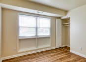 Thumbnail 21 of 24 - an empty bedroom with a window and a closet at Gates of West Bay in Virginia 23503