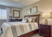 Thumbnail 13 of 15 - a bedroom with a large bed and a window