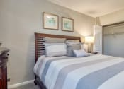 Thumbnail 6 of 15 - a bedroom with a bed and a closet